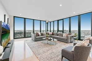 Penthouse | Living area | 55-inch Smart TV with cable channels, TV