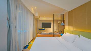 Habitación Deluxe | Colchones Select Comfort, minibar con artículos gratuitos, ropa de cama