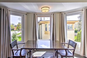 Enjoy meals in this dining area with a glass-top table and comfortable seating for four.