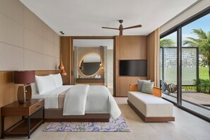 A modern bedroom with a large bed, a TV, a ceiling fan, and a view of the outdoors. - The Westin Resort & Spa Cam Ranh (Cam Lam)