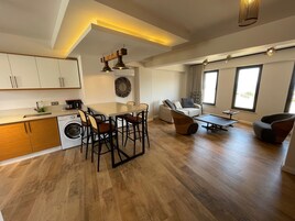 Deluxe Duplex, Kitchen, Sea View | Living area | 43-inch Smart TV with satellite channels, TV, Netflix