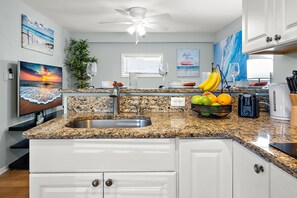 Fridge, microwave, stovetop, coffee/tea maker