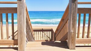 A wooden staircase leading to a beach with a clear view of the ocean. - Luxury, Ocean Front, Cargo Lift, 3rd Floor Penthouse KD0003 (Kill Devil Hills)