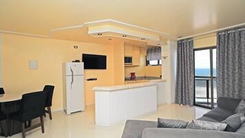 Apartamento executivo | Área de estar | TV