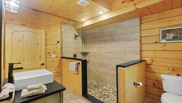 Shower, hair dryer, towels, toilet paper