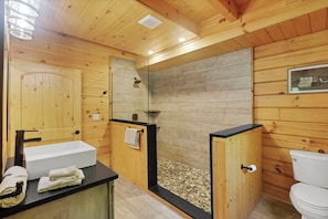 Shower, hair dryer, towels, toilet paper