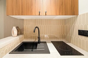 Fridge, microwave, stovetop, coffee/tea maker