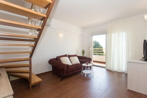 Appartement, plusieurs lits | Salle de séjour