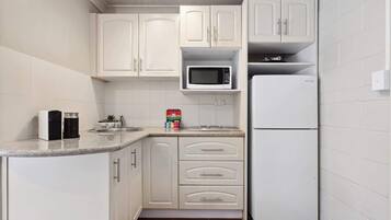 Fridge, microwave, stovetop, coffee/tea maker