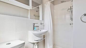 Shower, hair dryer, towels, shampoo