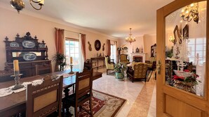 A traditional living room with a fireplace, wooden furniture, and decorative items. - LAGOS TYPICAL HOUSE by HOMING (Lagos)