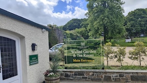 A sign for Glenarm Castle and Garden's Walled Garden & Tea Room main entrance. - Castleview Large 3 Bedroom Family House - Glenarm (Ballymena)