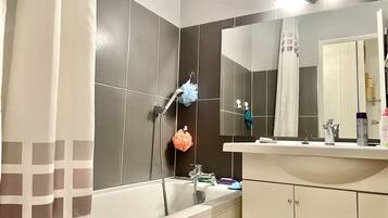 Bathtub, hair dryer, towels