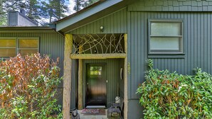 A house with a porch, a door, and a window. - Private Renovated home 1.5 Miles to downtown Highlands!  (Highlands)