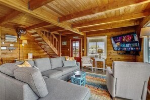 Flat-screen TV, DVD player, books