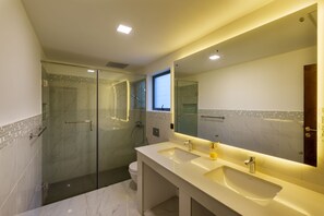 Shower, hair dryer, towels, toilet paper