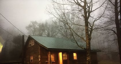 Rustic log cabin in the woods with great sunset views