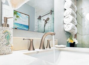 Shower, hair dryer, towels