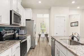 Coffee/tea maker, fridge, microwave, oven