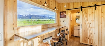 Off-grid tiny home in apple orchard with million-dollar mountain views!
