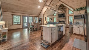 A spacious log cabin with a large kitchen, dining area, and a cozy living room. - Take a Paws - close to downtown, fenced yard, pets (Blue Ridge)