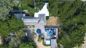 An aerial view of a house with a swimming pool, a deck, and a fenced garden area. - Quintessential Renovated Historic Cottage in Neskowin Village + Hot Tub (Neskowin)