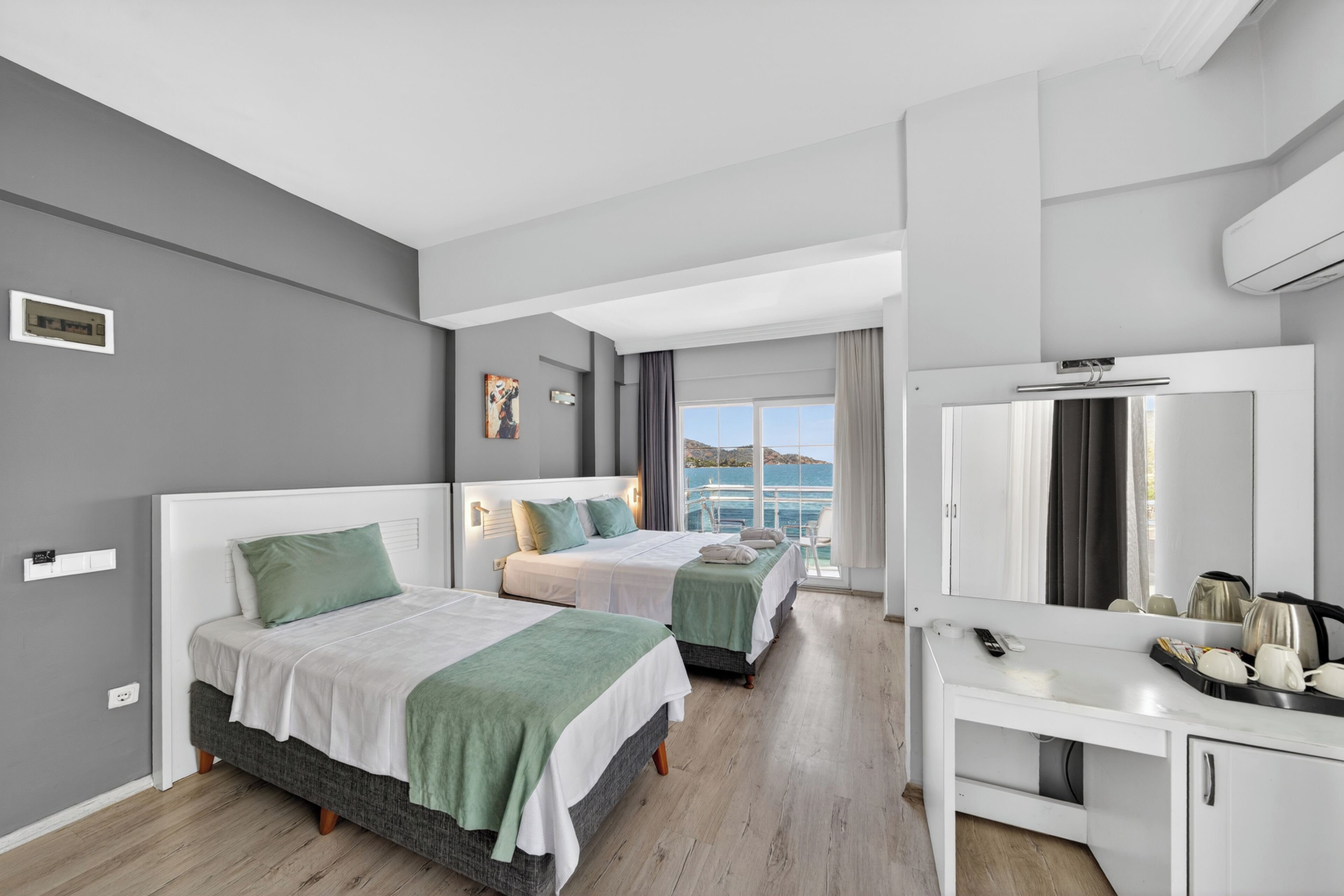 Superior Triple Room, Sea View | Minibar, laptop workspace, free WiFi, bed sheets