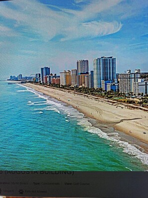 A beachfront condominium with a view of the ocean and a city skyline. - 4 miles from beach, but half the price and on the golf course. Newly renovated! (Myrtle Beach)