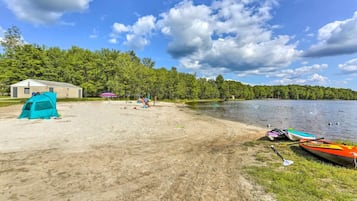 Enjoy water activities and scenic views from this lakeside campsite with a sandy beach and canoe access.