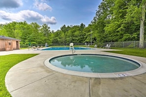 Outdoor pool, a heated pool - Romantic Pocono Lake Chalet: Firepit, Stream, near Lake, pools & Pet-Friendly (pocono lake)