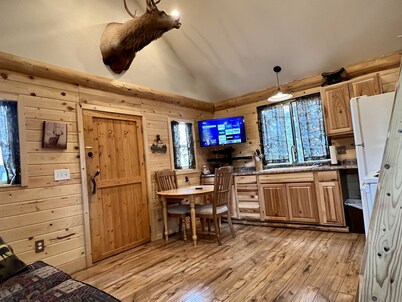 Loft cabin nestled in the woods with two acres to yourself.