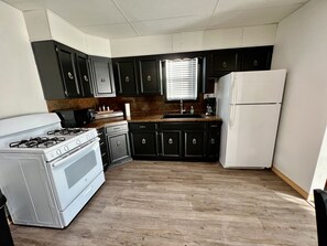 Fridge, microwave, oven, stovetop - The Bungalow House; 2 Bed 1 bath; minutes from Cheyenne Bottoms! Pet Friendly. (Claflin)