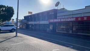 A street view with a building featuring a sign for 'AYR CHINESE RESTAURANT' and 'AYR HOTEL'. - Ayr Hotel (Ayr)