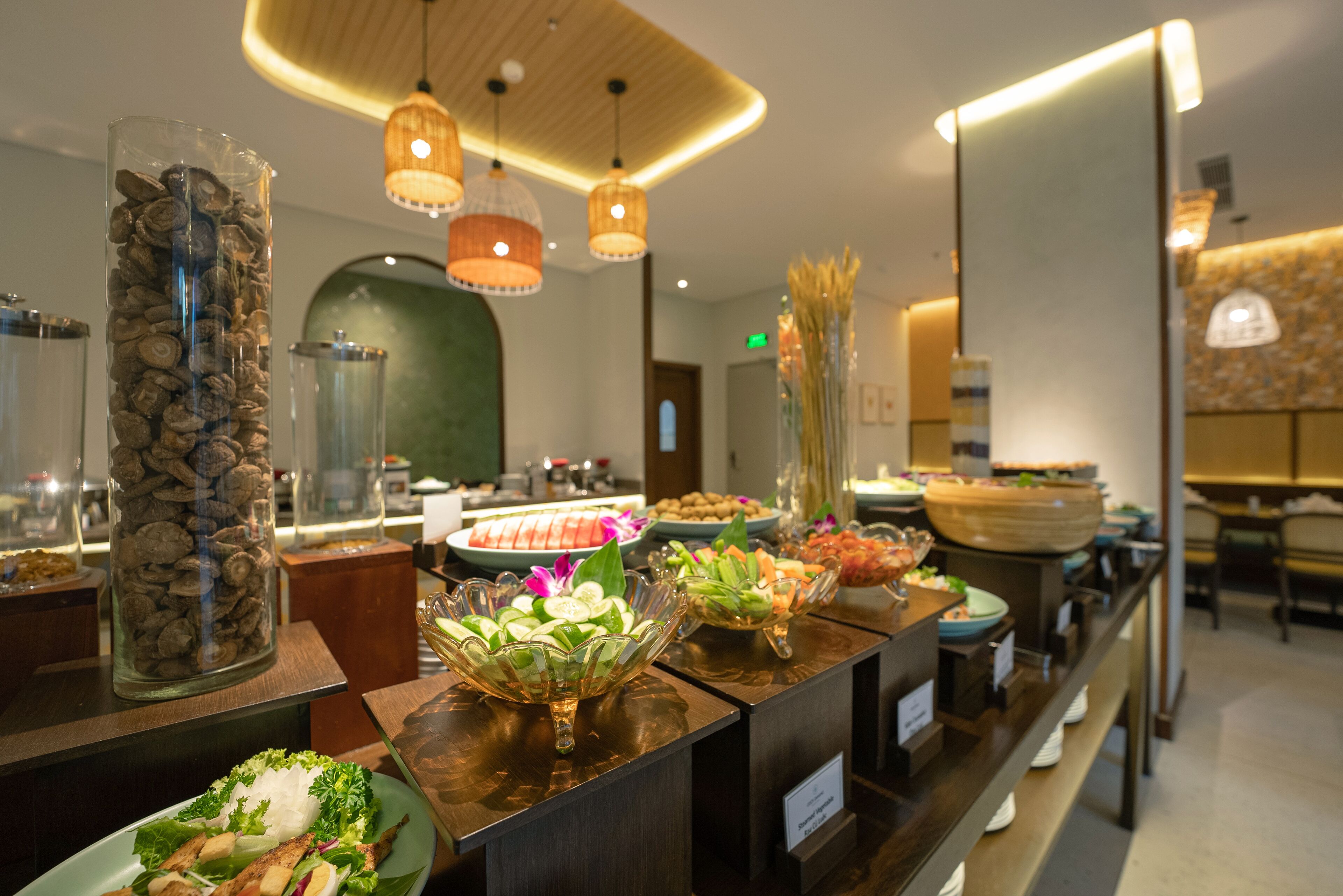 A buffet area with various food items and decorative elements.