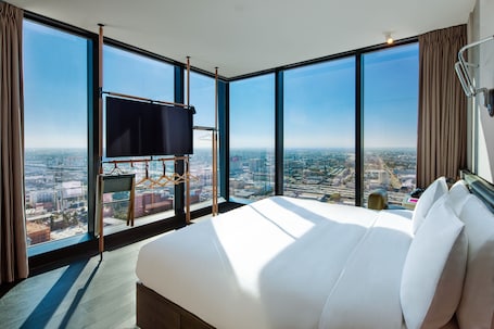 In-room safe, desk, laptop workspace, blackout drapes. Moxy Downtown Los Angeles