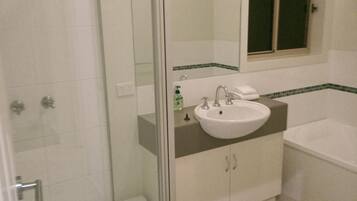 Bathtub, hair dryer, towels, soap