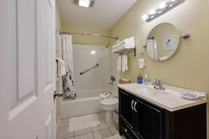 Combined shower/bathtub, hair dryer, towels, shampoo