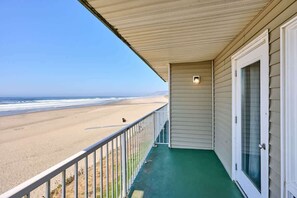 A balcony with a view of the beach.