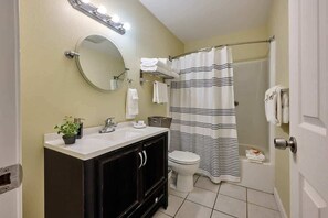 Combined shower/bathtub, hair dryer, towels, shampoo