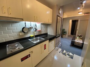 Fridge, dishwasher, electric kettle, cookware/dishes/utensils