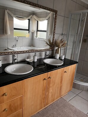 Bathtub, hair dryer, towels, soap