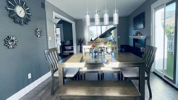 Formal dining area with a large table and six chairs, perfect for meals and social gatherings.