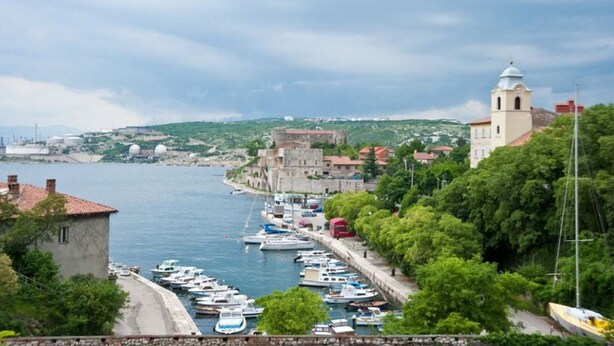 A coastal town with a marina, historic buildings, and a prominent church tower. - Attractive holiday home in Kraljevica with garden (Kraljevica)