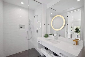 Shower, hair dryer, towels, shampoo