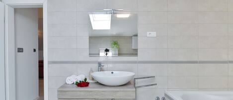 Bathtub, hair dryer, towels