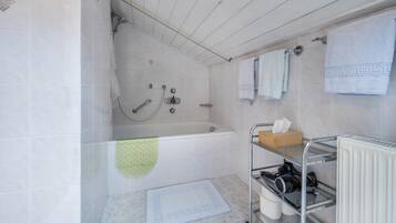 Bathtub, hair dryer, towels