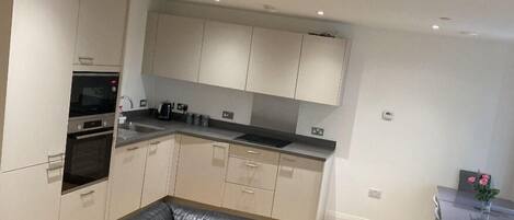 Apartment, 2 Queen Beds | Private kitchen | Fridge, microwave, oven, stovetop