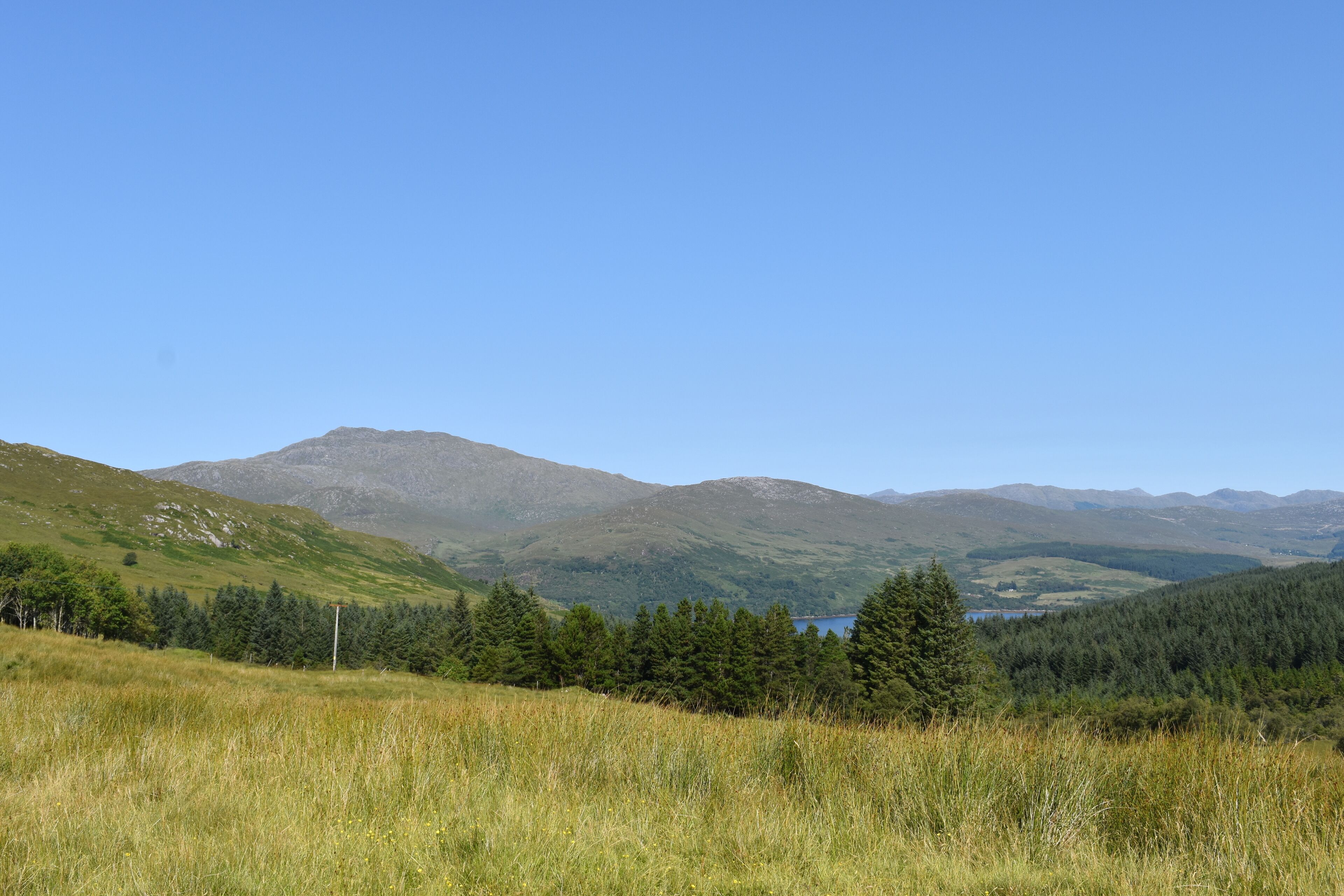 A mountainous landscape with a clear sky.