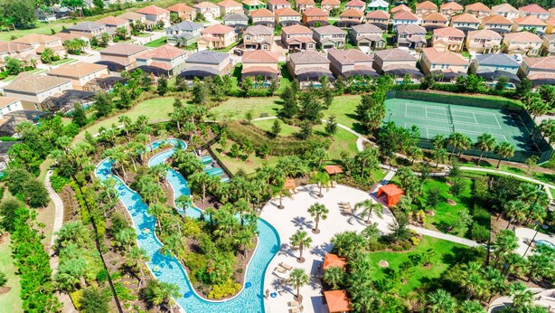 An aerial view of a residential area with houses, a swimming pool, and a tennis court. - Your Well-Deserved Resort Pool Home Getaway, Quality and Value, Mins to ºoº (Davenport)