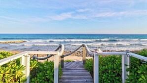 A wooden pathway leading to a beach with waves, surrounded by greenery. - Endless Summer - Perfect Getaway near Tahiti Beach (Hope Town)